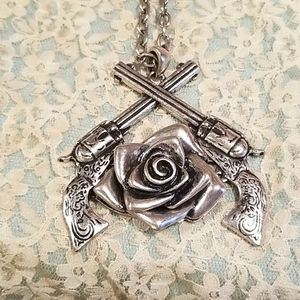 Silver necklace with shotgun and roses pendant